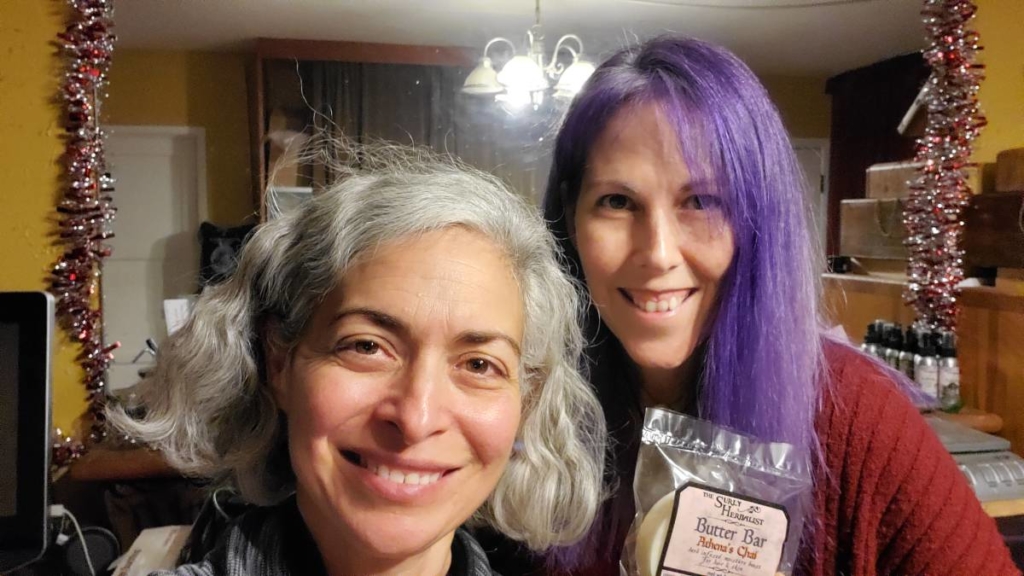 a woman with grey hair with a woman with purple hair