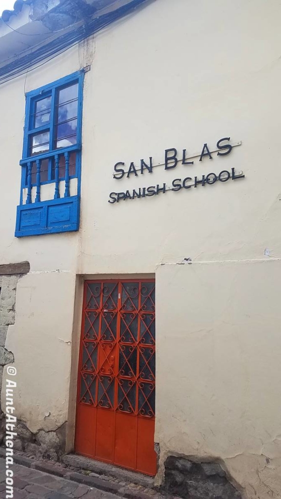 Red front door of the San Blas Spanish School